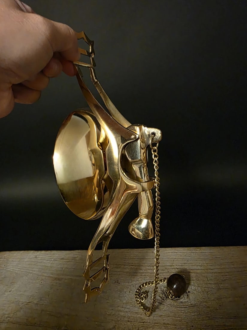 11" Wall Mount Brass Pull Chain Door Bell: 11"H x 4.5"Dia Crafted in polished brass with classic turn-of-the-century charm, this wall-mounted trolley bell brings back the unmistakable ring once heard on early streetcars and station platforms.