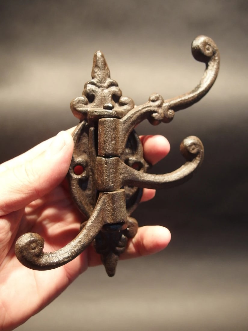 Cast Iron Wall Hook Swivel Folding Coat Hanger: 1) Hook 5 1/2" Tall.. 2" Wide 4" Extension Great sturdy reproduction iron wall hook cast from an antique. 3 folding arms Great textured black/brown color powder coat... a very sturdy finish. Reserve: 