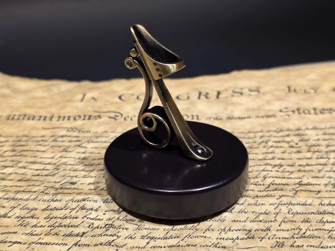 Antique Style Bronze & Wood Single Pen Holder: Cut out area for Pen - 0.25" 1 3/4" tall. Small reproduction bronze pen holder set on a solid wood base, designed to display a single pen at an easy angle for everyday use. The scroll-style bronze