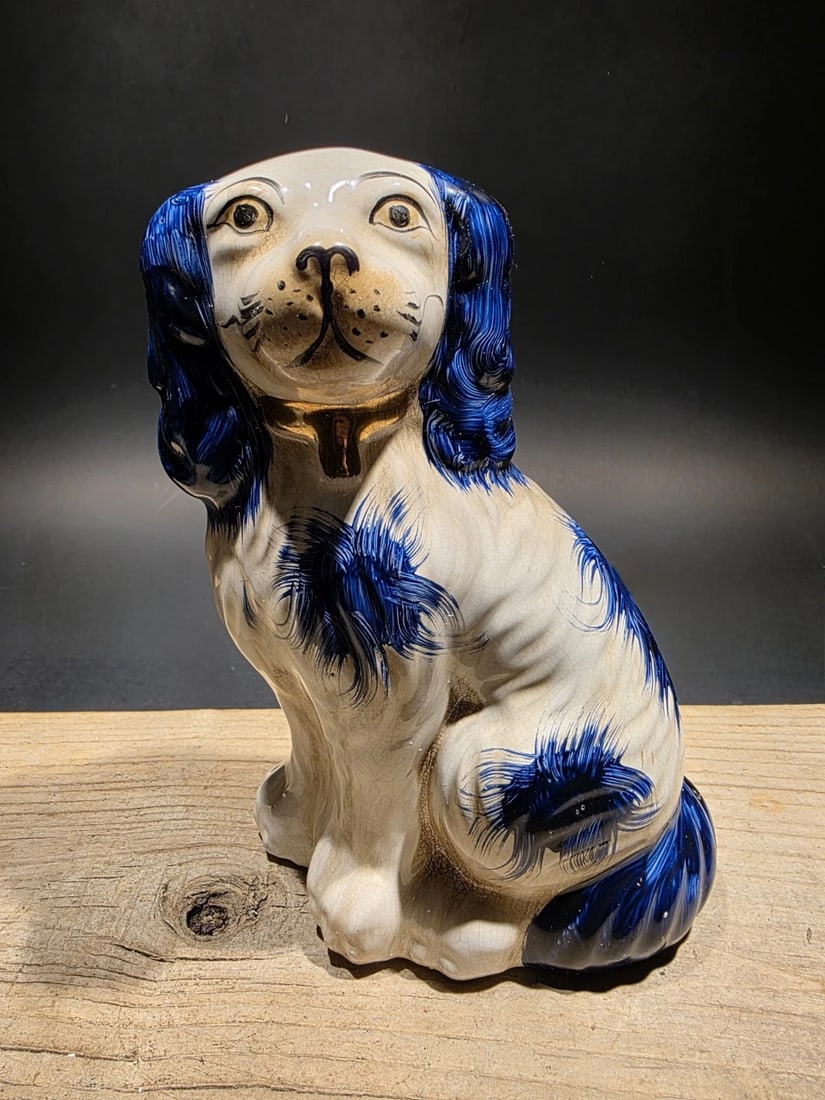 8" Blue Staffordshire Spaniel Dog Figurine: 8" Tall Roughly 1 pound Wonderful Reproduction Staffordshire Spaniel figurine Popular in England from the 18th century onward. These figurines, often produced in Staffordshire, are commonly modeled