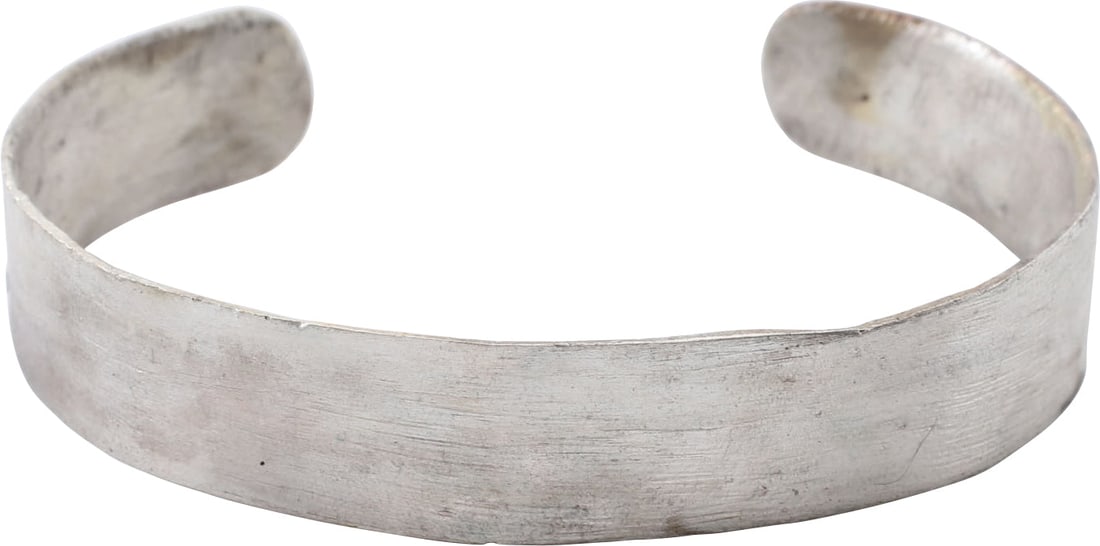 ROMAN BRACELET C.1ST-2ND CENTURY AD: Gilt bronze, 2.60" inside dimension. Just over 1/2" width (0.51" ?) with spatulate terminals. Suitable for wear by a woman or man. Surface with light tool finish as made. Professionally refurbished