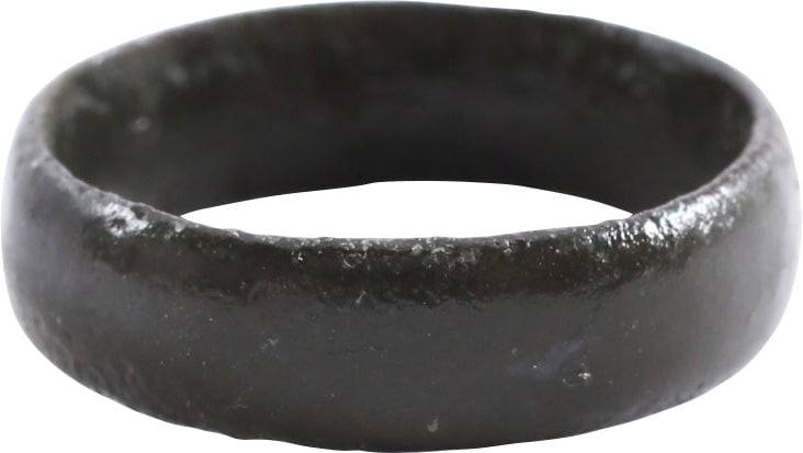 VIKING WARRIOR'S WEDDING RING AS FOUND, 900-1050 AD, SIZE 8: Bronze, size 8. 5.8mm width with low rounded face. Made with a core filling the inside which distributed the flowing metal and allowed for slower cooling. The core was then laboriously removed by