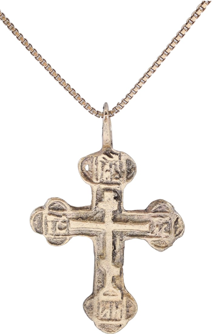 EASTERN EUROPEAN CHRISTIAN CROSS NECKLACE: 17th-18th century, Orthodox rite. Silvered bronze, over 1/14" (1.26") total height. Relief decorated with raised edges to the front enclosing a vacant cross with cipher(?) panels to the beam ends. Rev