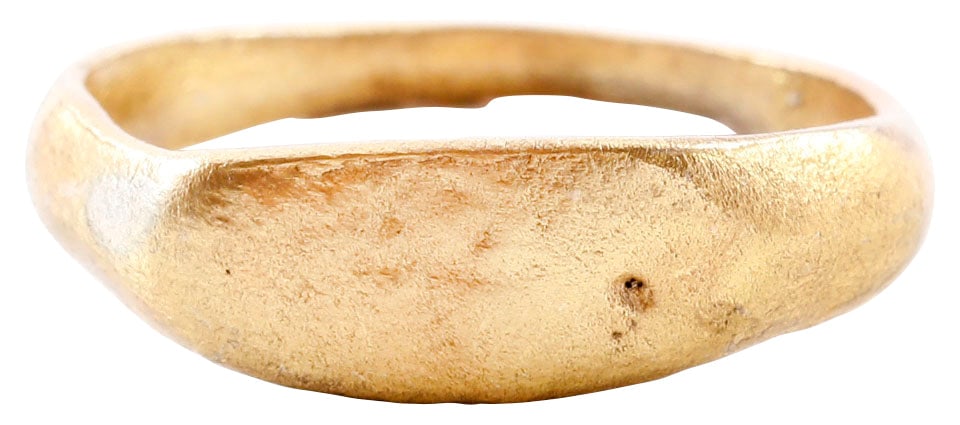 LATE ROMAN/MEDIEVAL SIGNET RING C.5TH-8TH CENTURY, SIZE 9 1/4: 5th-8th Century AD. Gilt bronze size 9 1/4 with 2.6 mm band. Typical Roman characteristics are the lozenge shaped bezel and stepped shoulders. The thick raised bezel has incised figures, obscured by