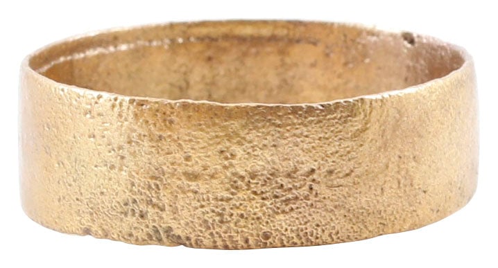 CELTIC WEDDING RING 500-1000 AD, SIZE 9 3/4: British Isles. Gilt bronze, size 9 3/4. Plain broad band, 6.6mm width with traces of a medial stipple decoration. Professionally refurbished with the 24karat gold surface restored for modern wear.