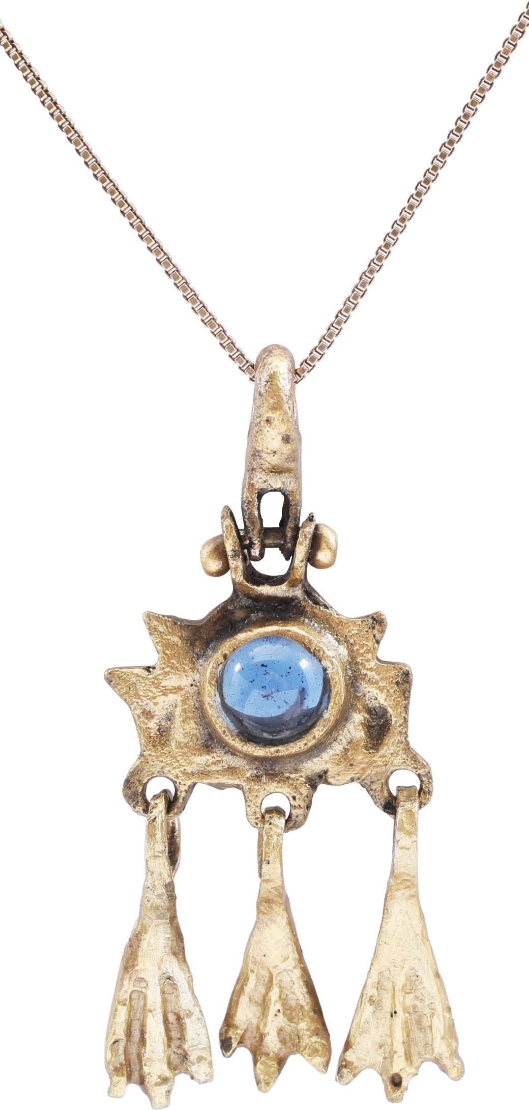 VIKING SORCERESS'S PENDANT NECKLACE. 10th-11th CENTURY AD: 1 1/2" height plus the suspension ring. The body as an oval with pairs of spikes or horns at the sides. The center with a cylindrical bezel mounted with a blue cabochon. The bottom with three intricat