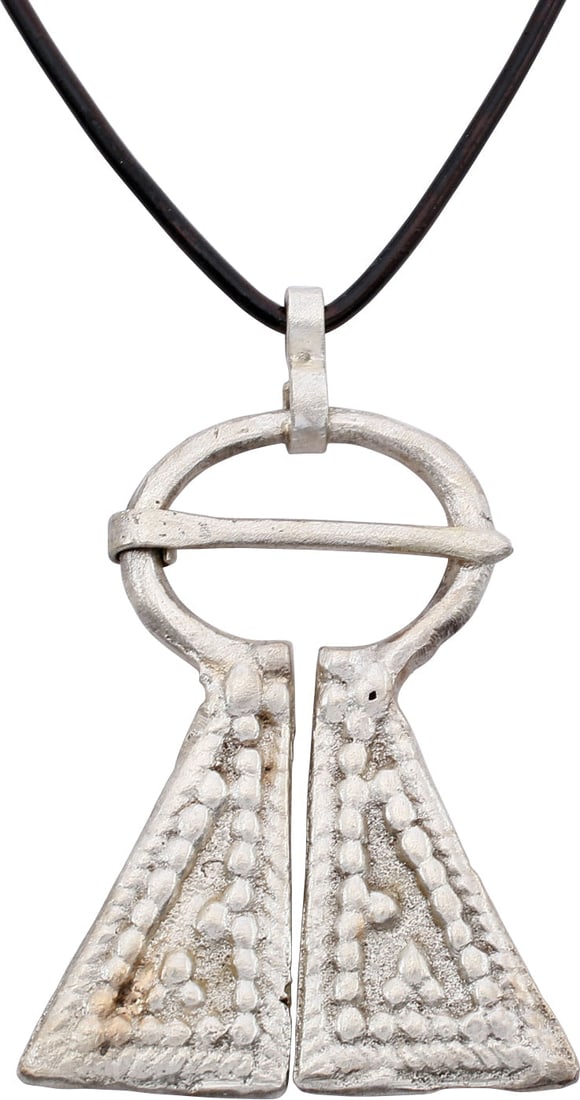 FINE VIKING PROTECTIVE BROOCH, C. 950-1050 AD: Large example, over 2" (2.08) height of omega form. Oval top with large triangular terminals decorated in pelleted triangles with double pelleted borders. The junctions with triple pellet decoration.