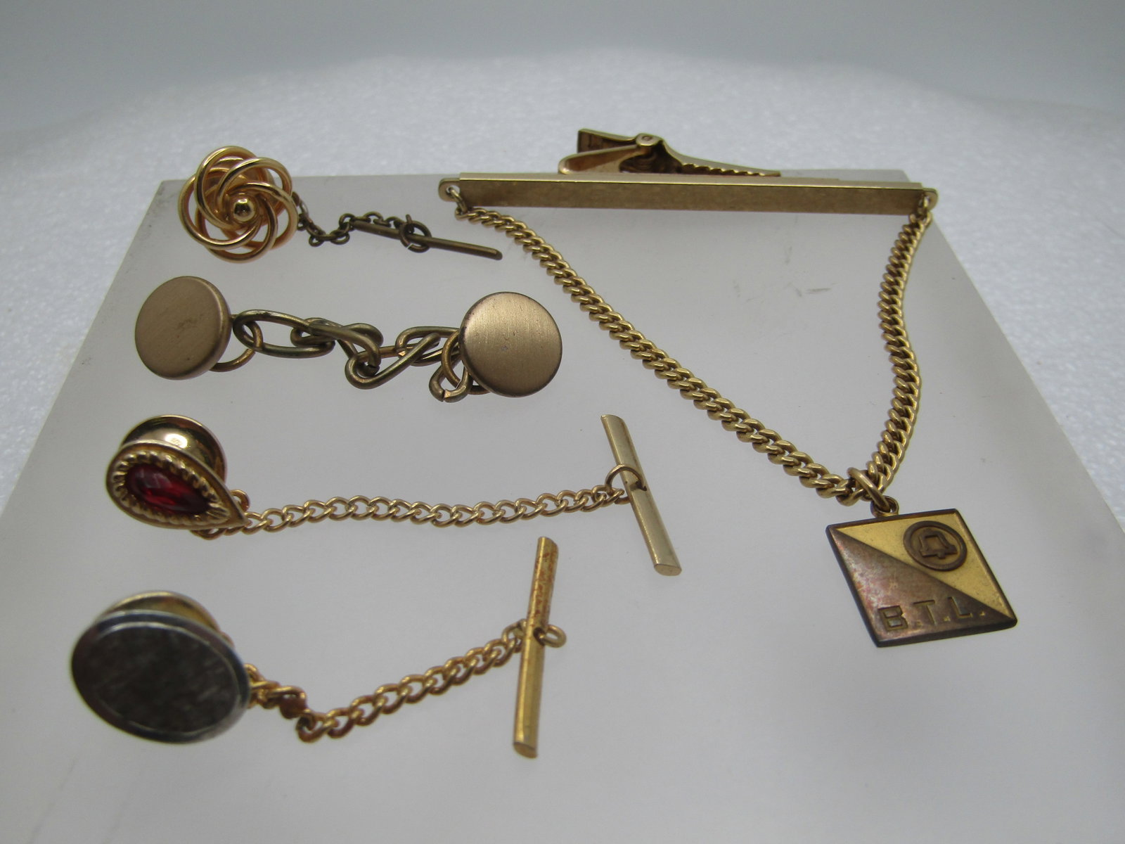 Vintage 12kt G.F. Bell Telephone Tie Clip and 3 Tie Tack Lot, 1940's-1960's: Title: Vintage 12kt G.F. Bell Telephone Tie Clip and 3 Tie Tack Lot, 1940's-1960's Description: Vintage 12kt G.F. Bell Telephone Tie Clip and 3 Tie Tack Lot, 1940's-1960's. The Bell Tell tie bar has a