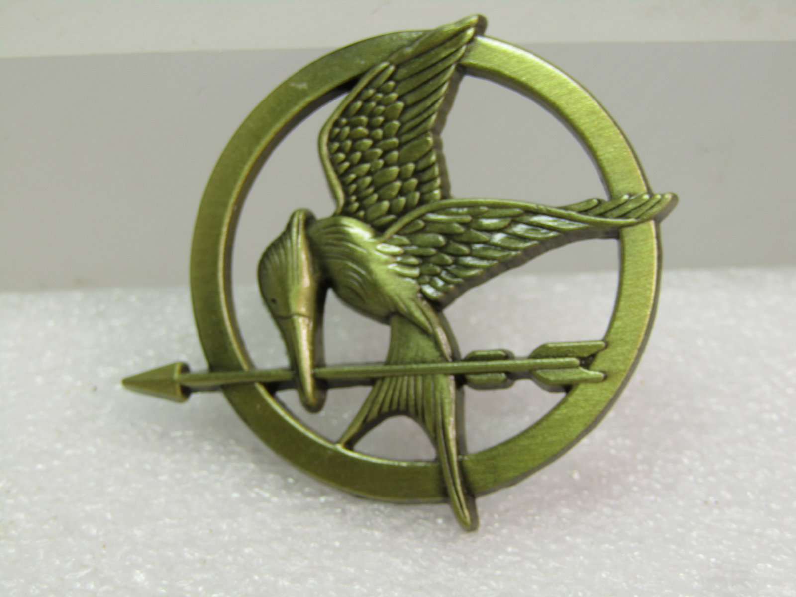 Hunger Games Mockingjay Tacck Pin. Signed L.G.F. - 2