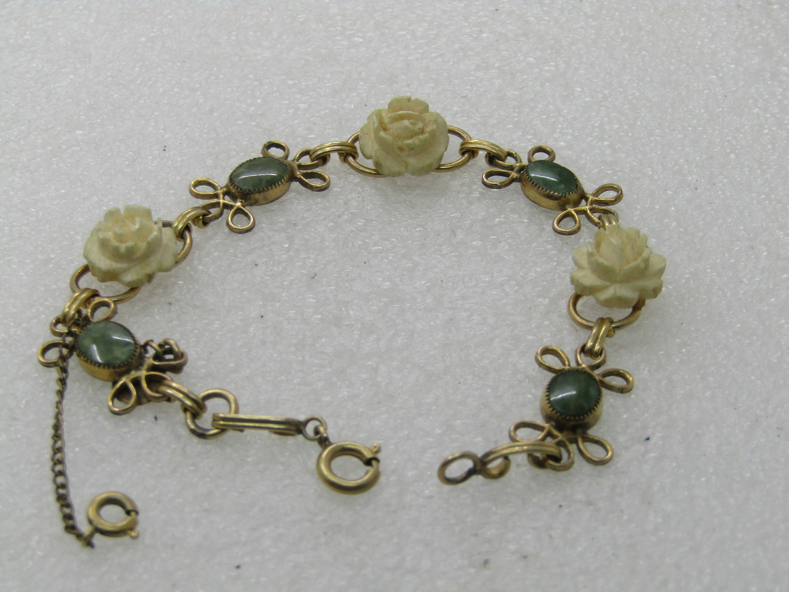 Vintage D'or Faux Carved Rose Bracelet with Green Stones, 7.5" - scrolled accent on each side of the - 2