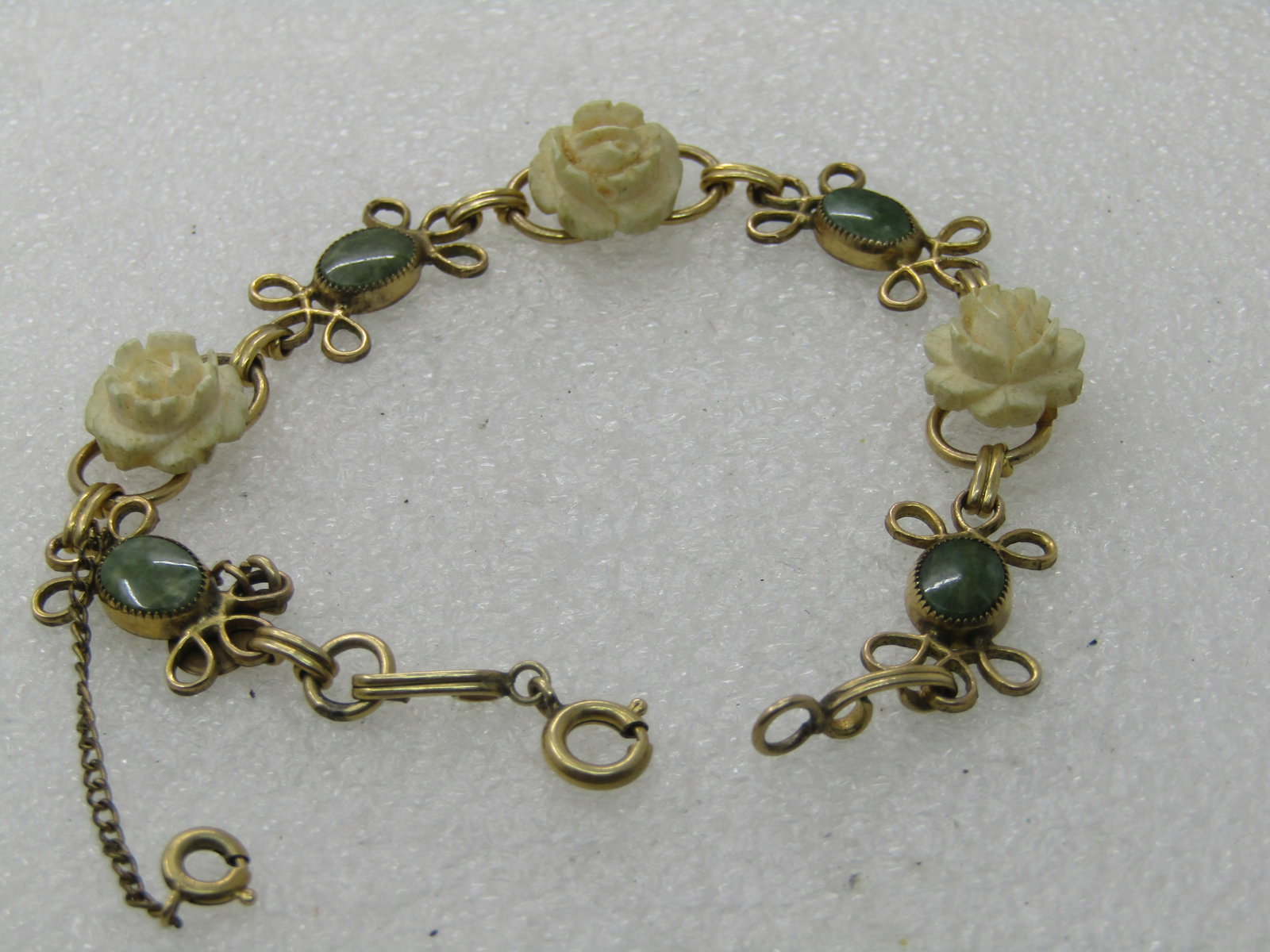 Vintage D'or Faux Carved Rose Bracelet with Green Stones, 7.5" - scrolled accent on each side of the - 3