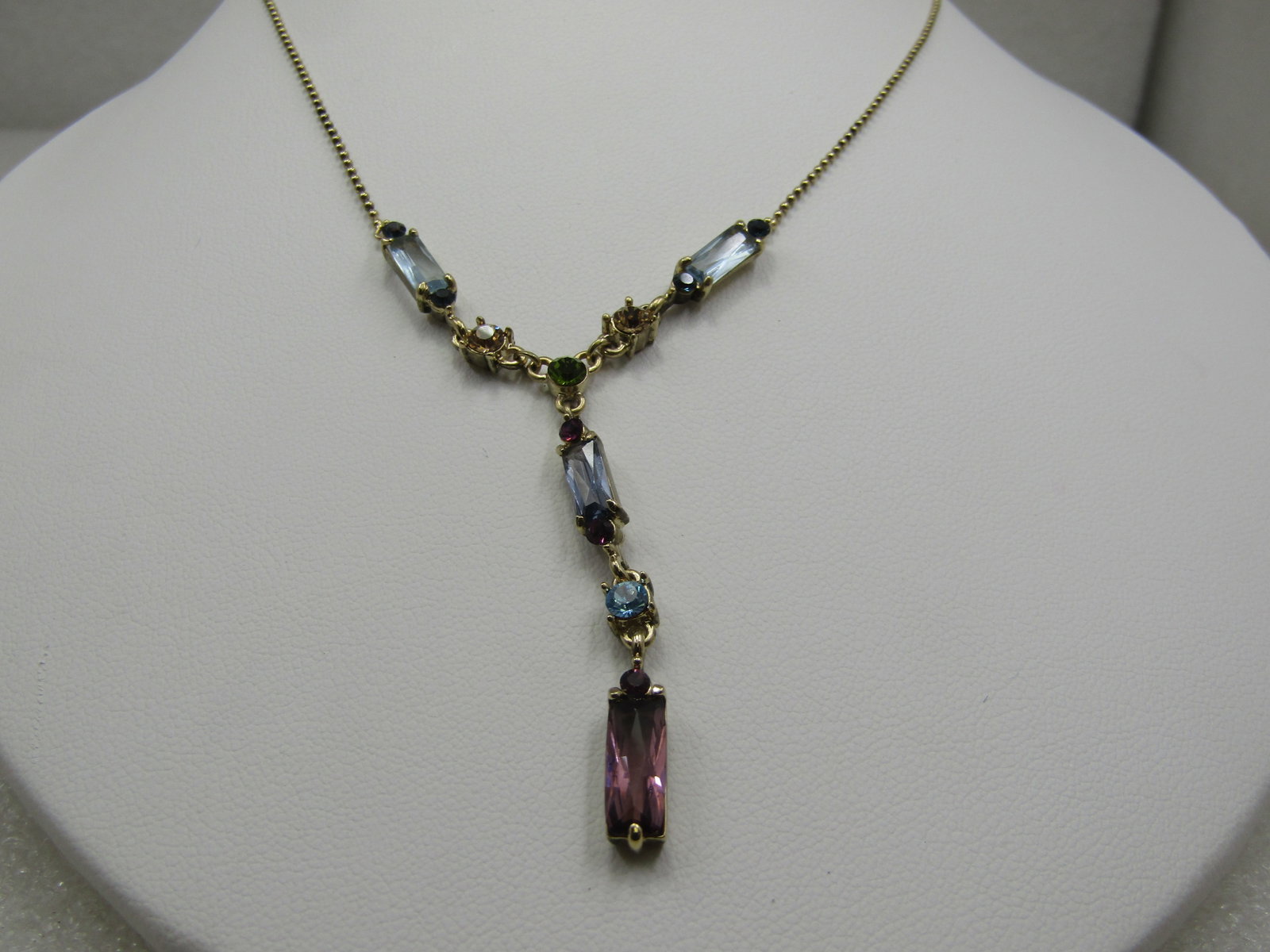 Early 1900's Heart Locket Necklace, 20" 12kt G.F.: Title: Early 1900's Heart Locket Necklace, 20" 12kt G.F. Description: Vintage Pastel Rhinestone Lavalier Necklace, 18" with 1.75" drop of baguette and round pastel glass rhinestones. Bail chain that