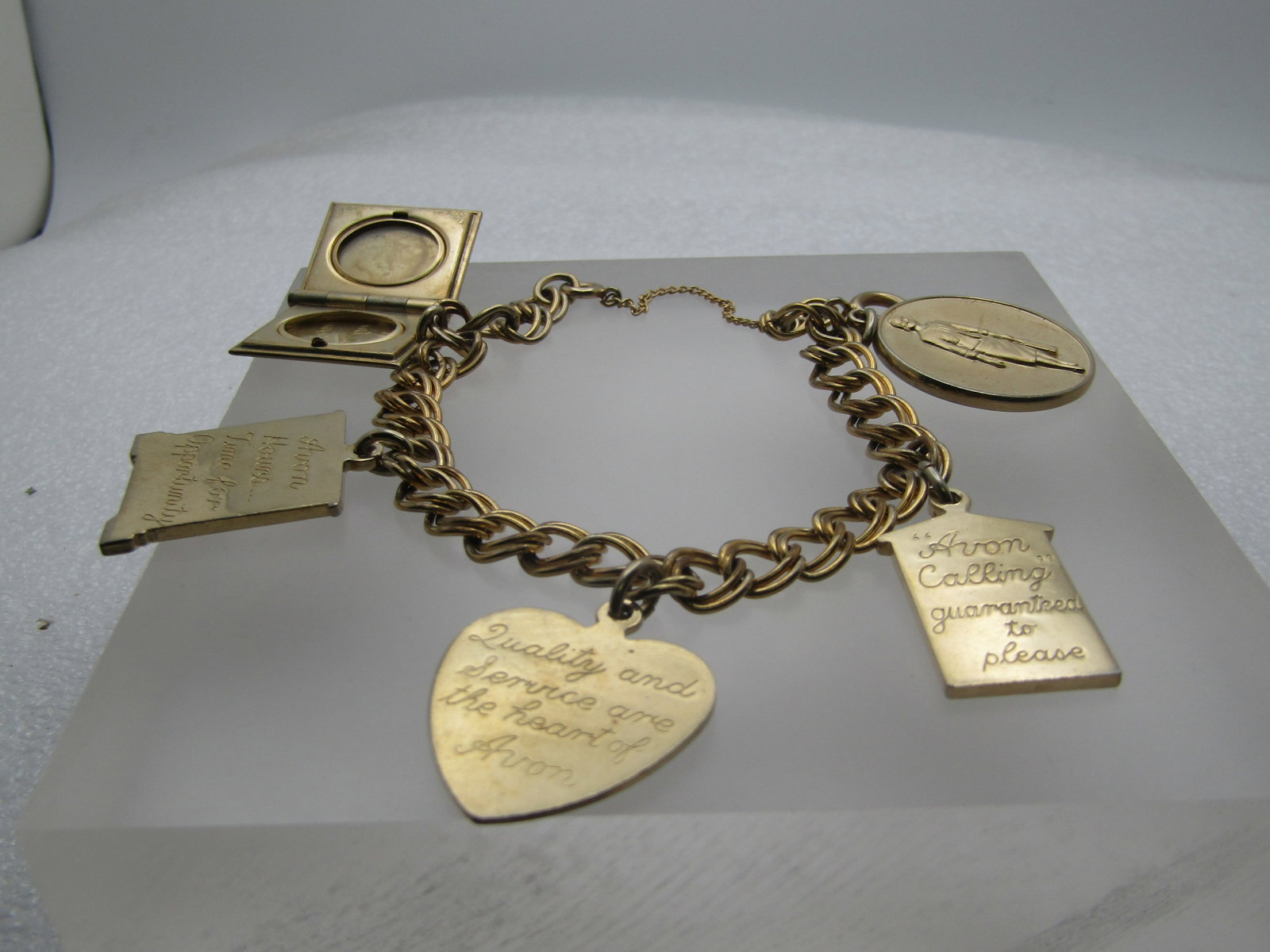 Vintage 10kt G.F. 1960's Avon Charm Bracelet, 7.25" President's Club and More: Title: Vintage 10kt G.F. 1960's Avon Charm Bracelet, 7.25" President's Club and More Description: Vintage 10kt G.F. 1960's Avon Charm Bracelet, 7.25" President's Club and More, Safety Chain, spring cl