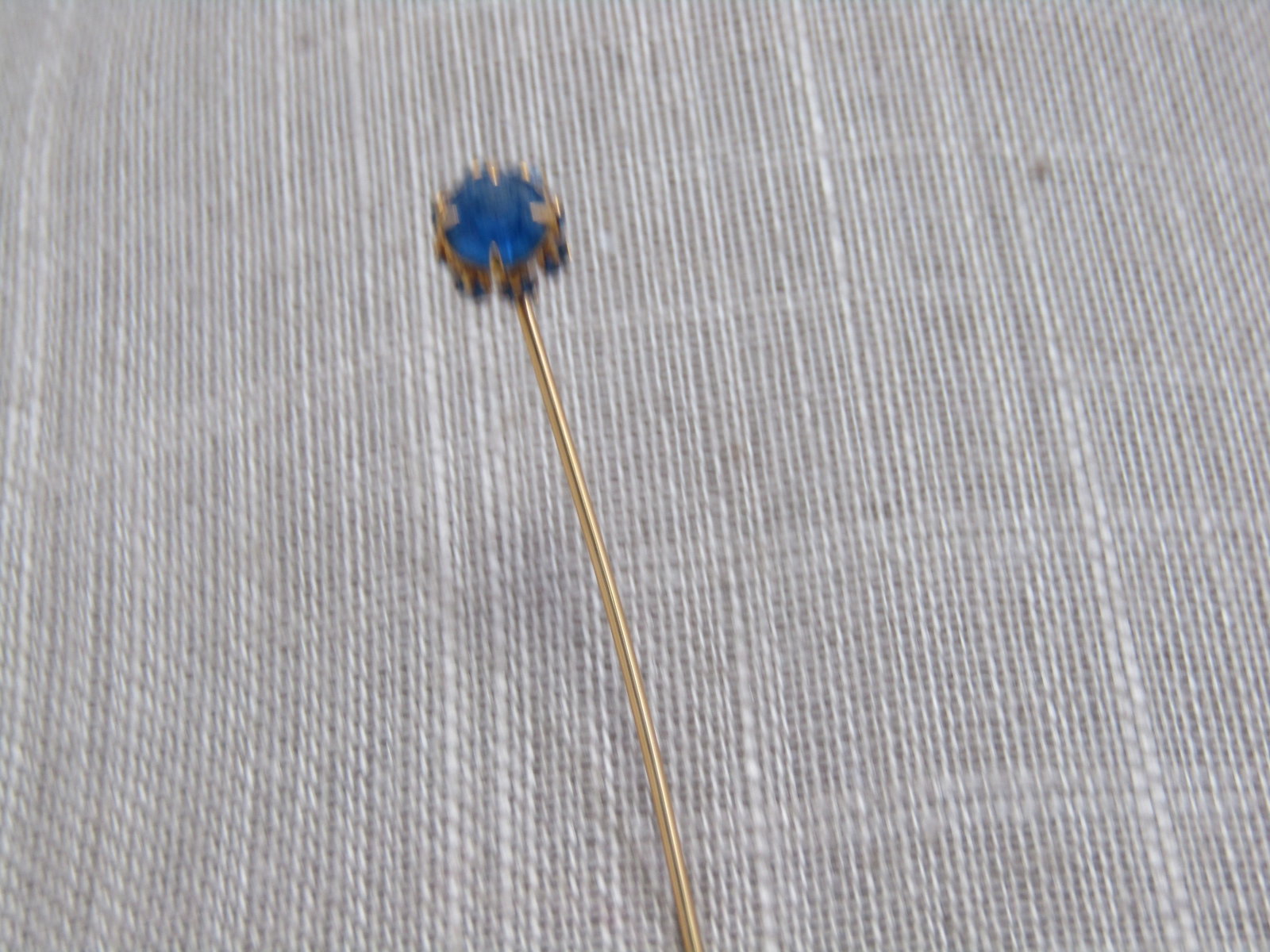Vintage Blue Rhinestone Stick Pin, 1920's-1930's: Title: Vintage Blue Rhinestone Stick Pin, 1920's-1930's Description: Vintage 10kt G.F. Blue Rhinestone Stick Pin, 1910's-1930's. Sapphire blue glass rhienstones with an old mine cut on the main stone,
