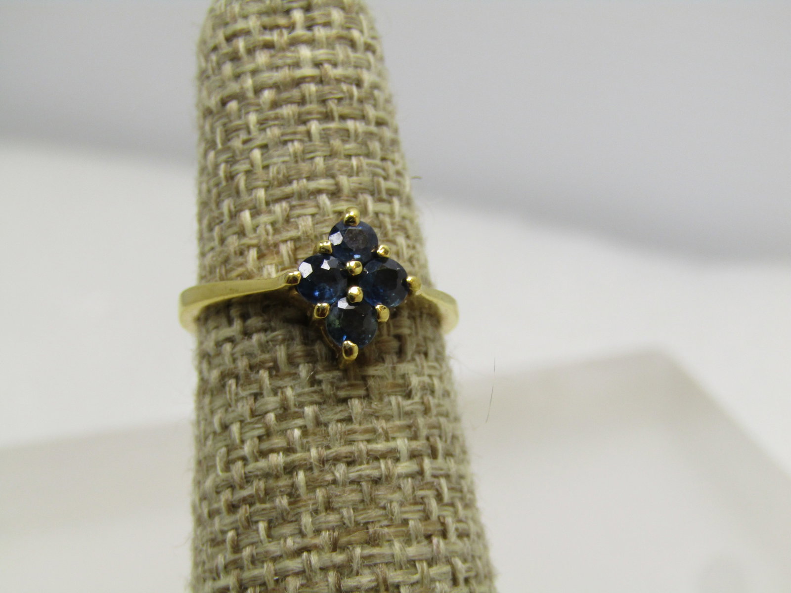 Vintage 10KT.G.F. Blue Topaz Ring, Sz. 5.25. 1980's: Title: Vintage 10KT.G.F. Blue Topaz Ring, Sz. 5.25. 1980's Description: Vintage 10KT.G.F. Blue Topaz Ring, Sz. 5.25. There are four 3mm dark blue stones prong-set in diamond pattern. The stones test