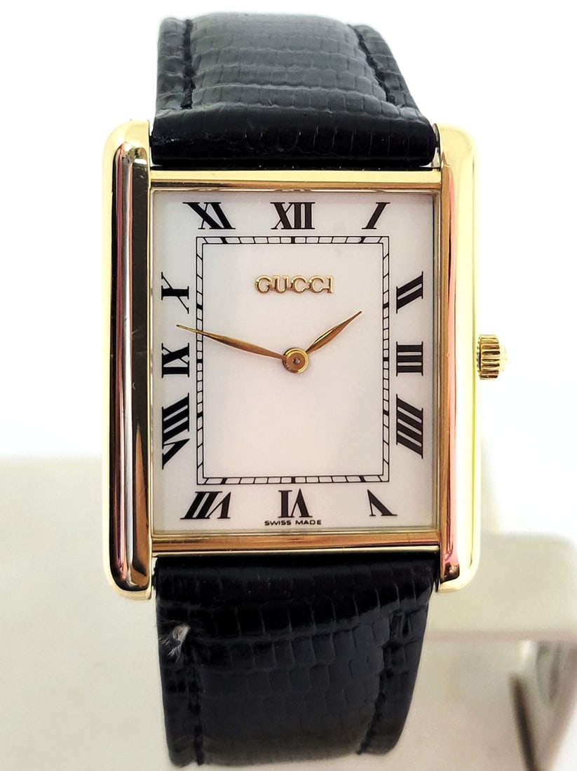 Solid 18k GUCCI TANK Unisex Watch 28 mm Ref 710 M* EXLNT: Solid 18k GUCCI TANK Unisex Watch 28 mm Ref 710 M* in Excellent Condition?? This Unisex CARTIER watch is Swiss made. Great present for yourself or someone you love! * Solid 18k yellow gold case & back