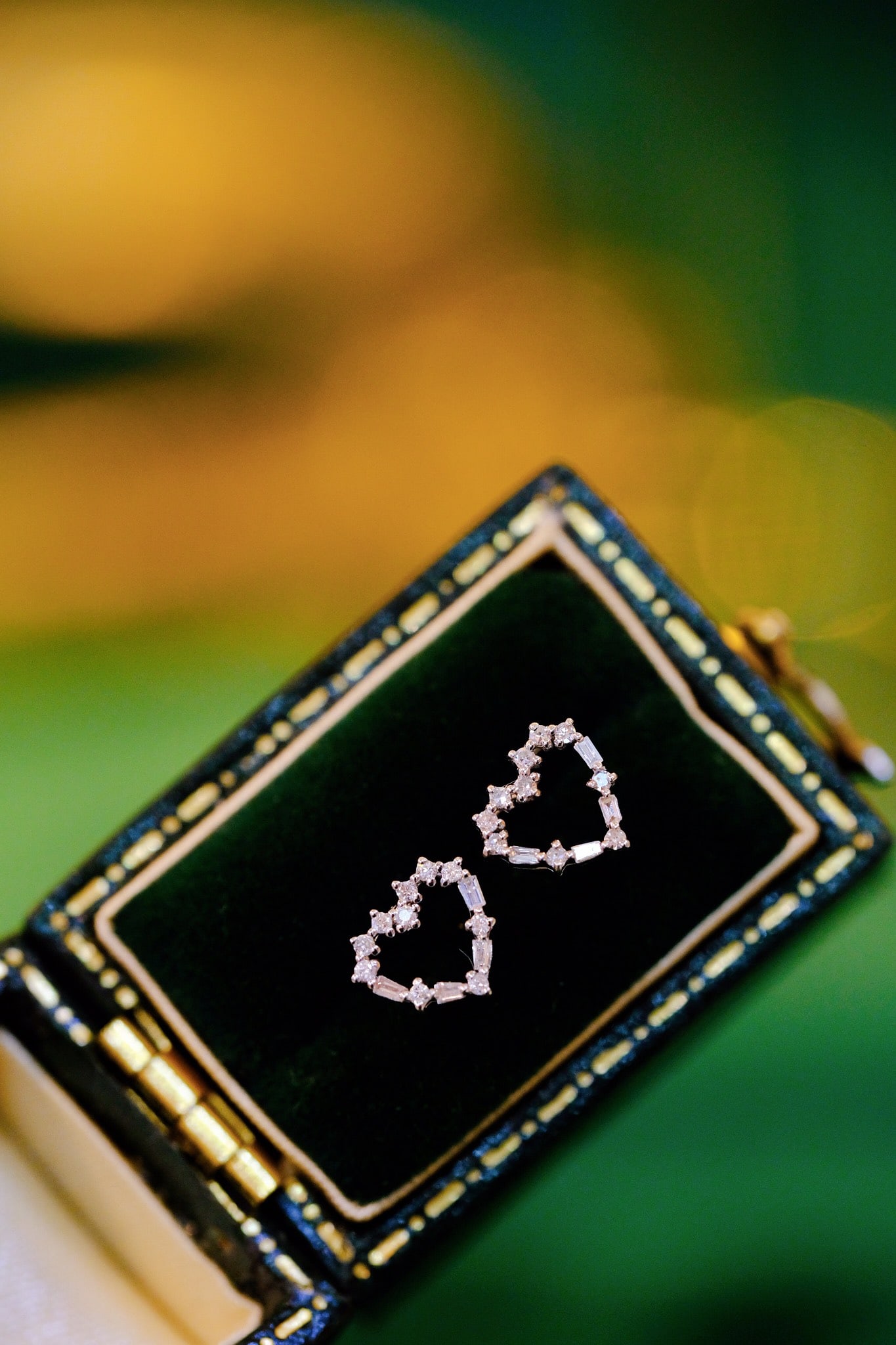 18K Natural Diamond Earrings: Title: 18K Natural Diamond Earrings Description: These earrings feature a minimalist heart design, showcasing a perfect blend of elegance and fashion. The petite diamond accents enhance the overall