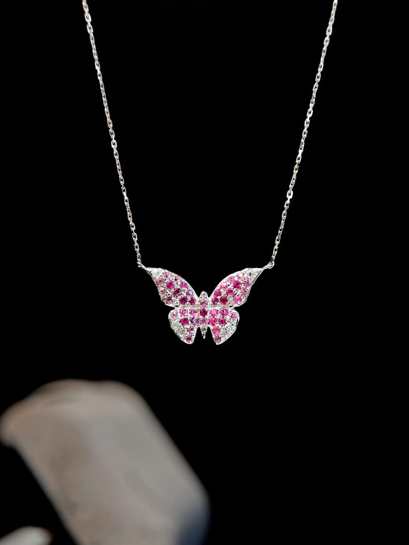 18K Gold Natural Pink Sapphire Butterfly Necklace: Title: 18K Gold Natural Pink Sapphire Butterfly Necklace Description: This 18K gold natural pink sapphire butterfly necklace perfectly showcases the charming curves of the collarbone with its