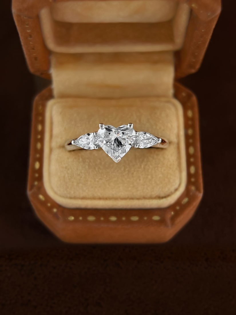 18K Cultivated Diamond Natural Heart Ring: Title: 18K Cultivated Diamond Natural Heart Ring Description: This ring showcases unparalleled elegance and charm with its unique heart design. The dazzling brilliance of the main stone captivates