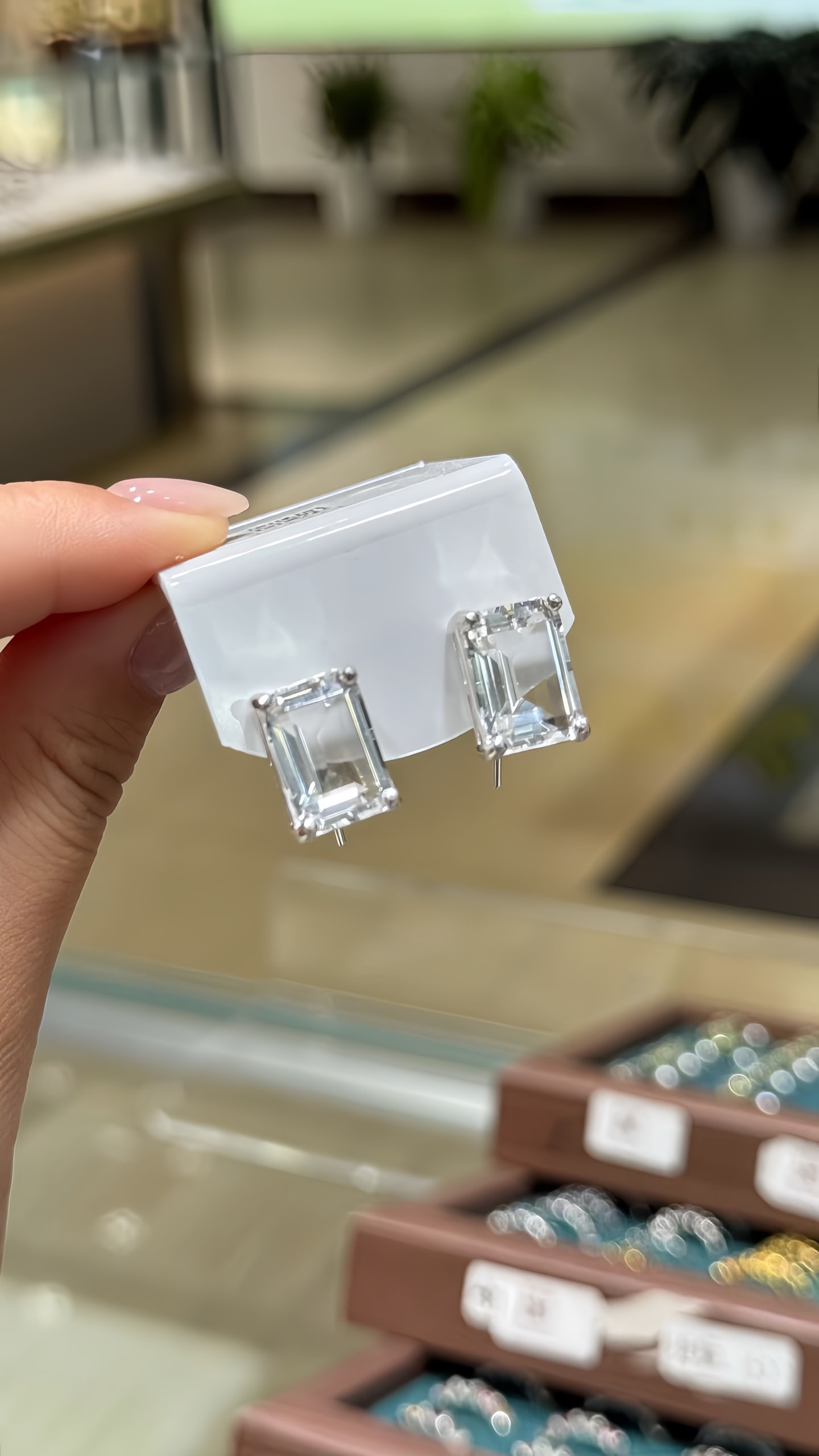 925 Silver Natural White Crystal Ear Hooks: Title: 925 Silver Natural White Crystal Ear Hooks Description: These ear hooks are crafted from 925 silver and set with natural white crystal, showcasing a design that is simple yet elegant. The