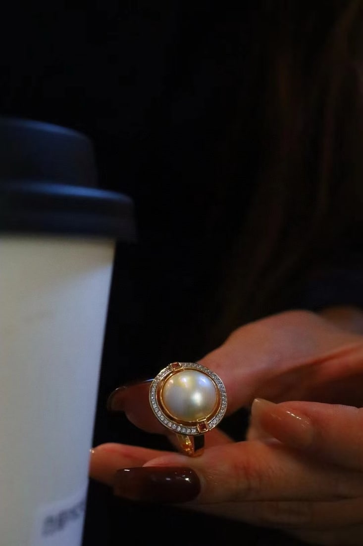 Natural Mabe Pearl Ring: Title: Natural Mabe Pearl Ring Description: This ring features a natural Mabe pearl as the main stone, showcasing its unique luster and elegant design. Crafted with gold-plated s925 silver, it