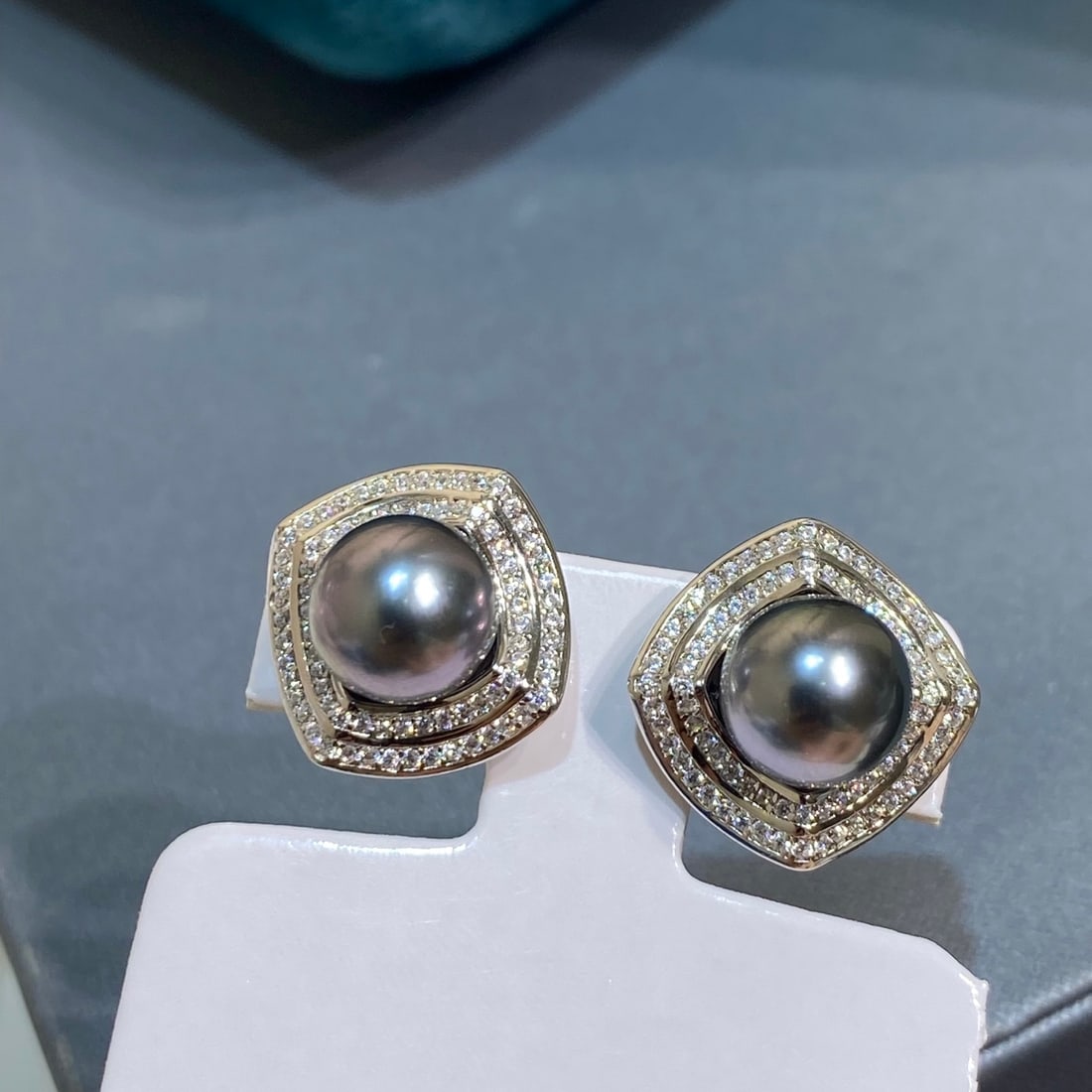 Natural Color Tahitian Sea Water Earrings: Title: Natural Color Tahitian Sea Water Earrings Description: These earrings showcase the unique charm of natural color Tahitian sea water pearls, with a diameter of 8-9mm, featuring a round shape