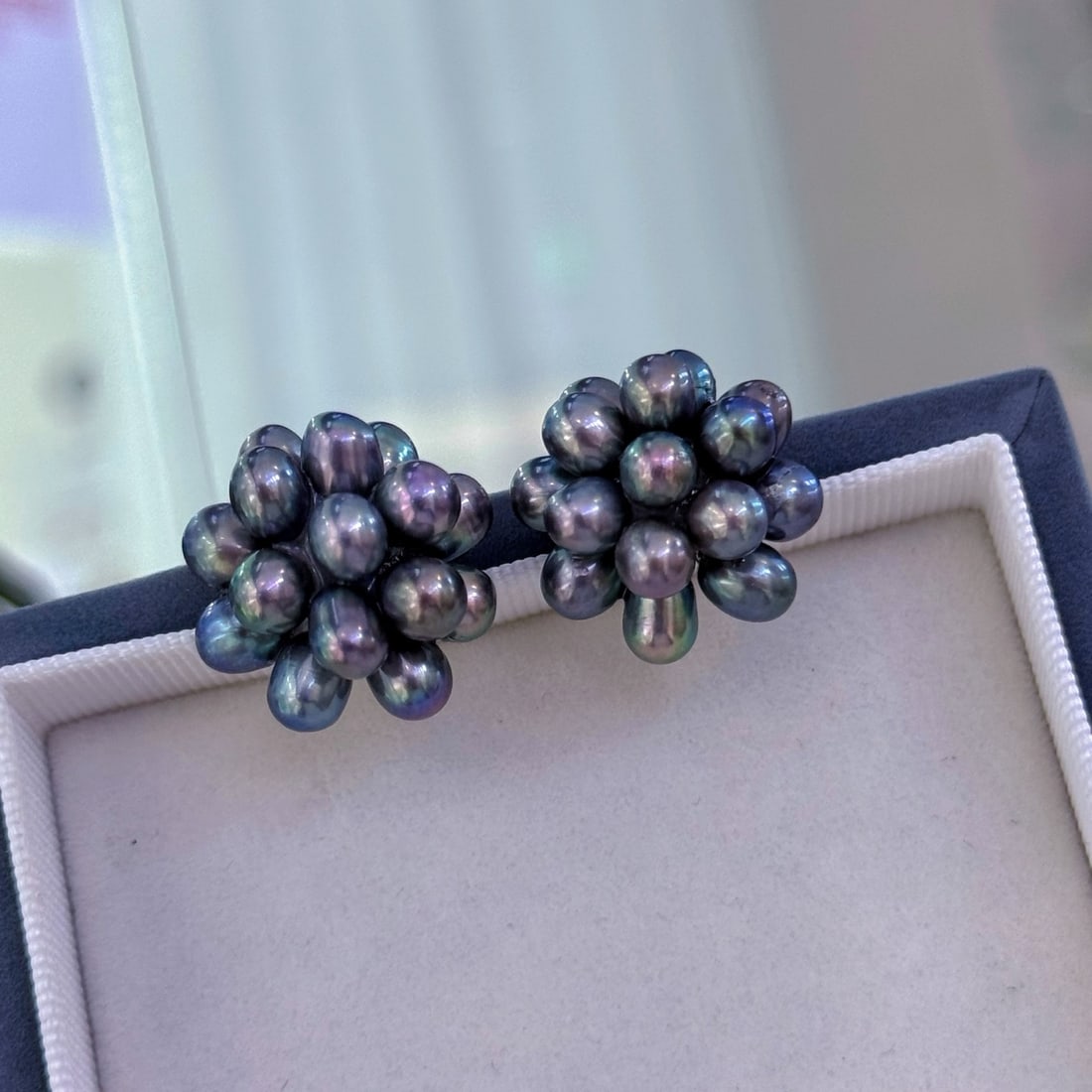Natural Black Pearl Earrings: Title: Natural Black Pearl Earrings Description: These earrings feature exquisite black pearls as the main stones, with a cluster design that showcases a unique firework effect. The delicate surface