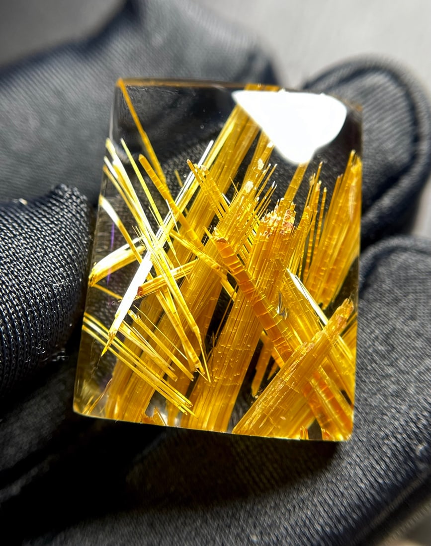 Natural Titanium Crystal Pendant: Title: Natural Titanium Crystal Pendant Description: This pendant is made of natural titanium crystal, featuring a transparent body with fine, dense inclusions and a captivating golden hue. Its
