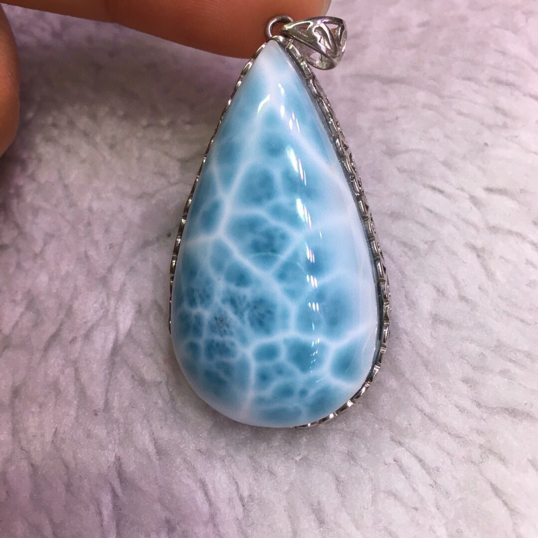Sterling Silver Natural Larimar Pendant: Title: Sterling Silver Natural Larimar Pendant Description: This pendant features natural Larimar meticulously set in sterling silver, showcasing a unique full turtle pattern that captivates the eye.