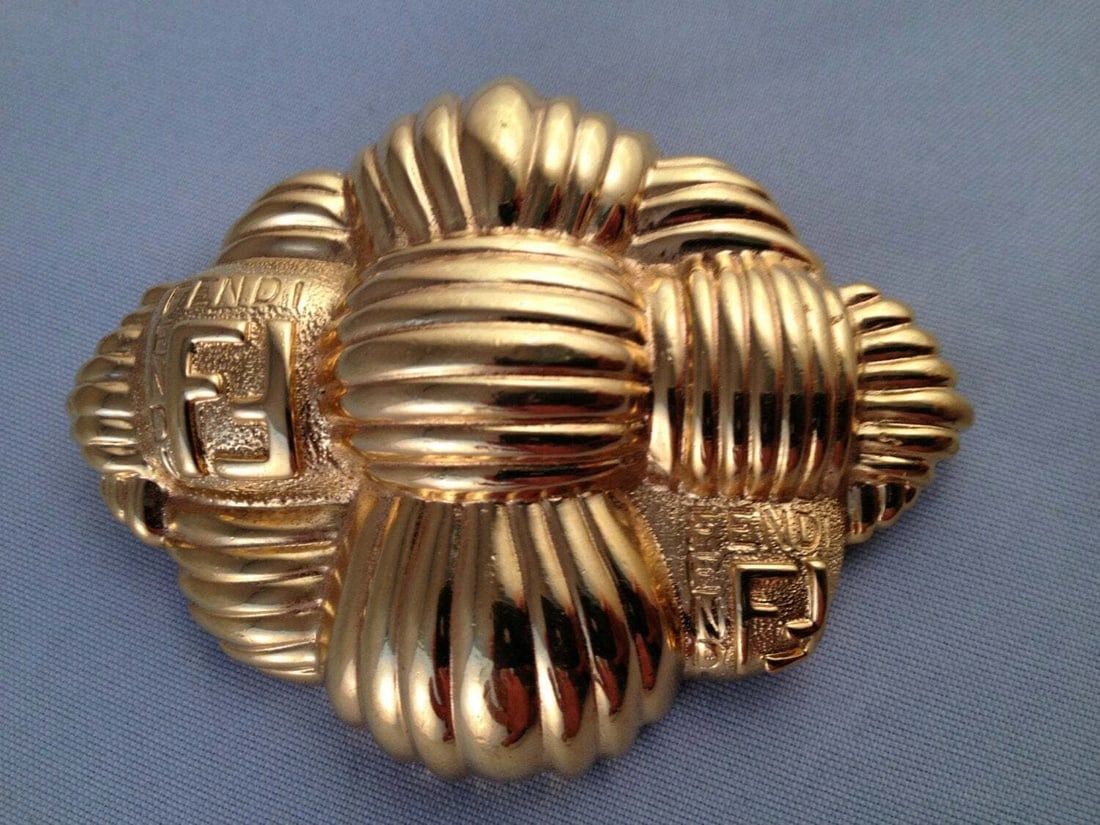 Fendi Basket Weave Brooch: Title:Fendi Basket Weave Brooch Description:A statement making fendi brooch. 18 kt gold plated metal with a basket weave design. Made in the 1980's. Monogrammed and measures 3" long by 2 1/4".