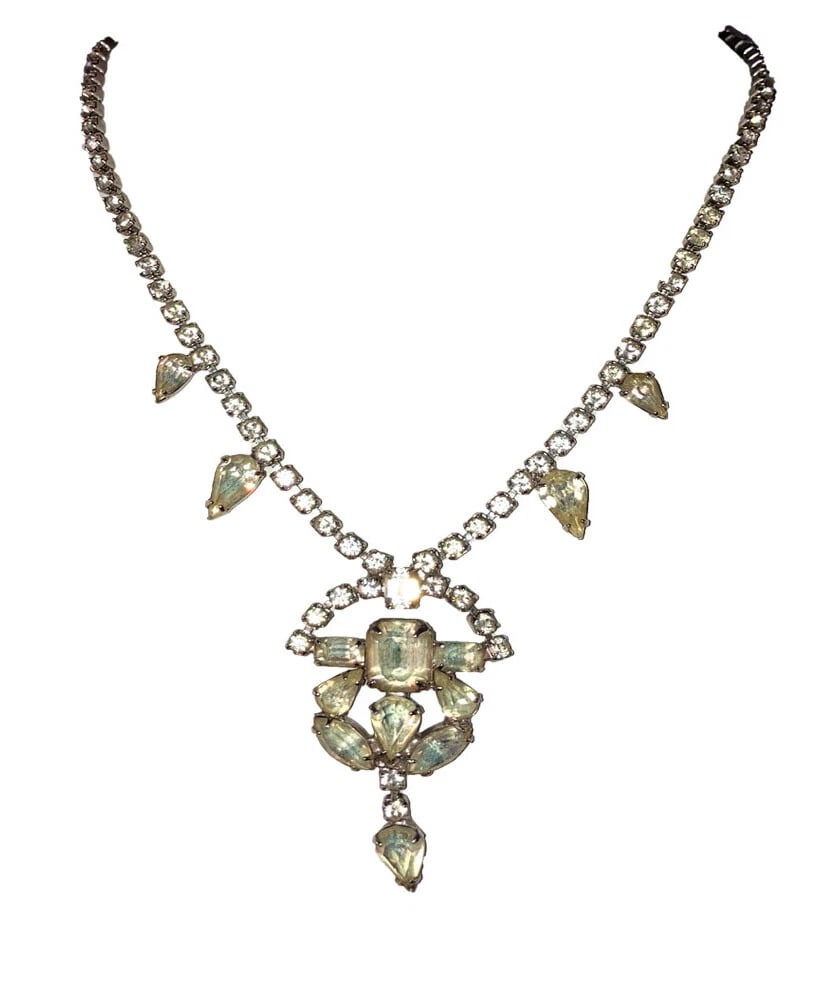 Vintage Costume Clear Rhinestone Pear Shaped Lavalier Necklace: Title:Vintage Costume Clear Rhinestone Pear Shaped Lavalier Necklace Description:Vintage Costume Clear Rhinestone Pear Shaped Lavalier Necklace. Circa 1950's. Measures 15" long and 2" wide. Pendant