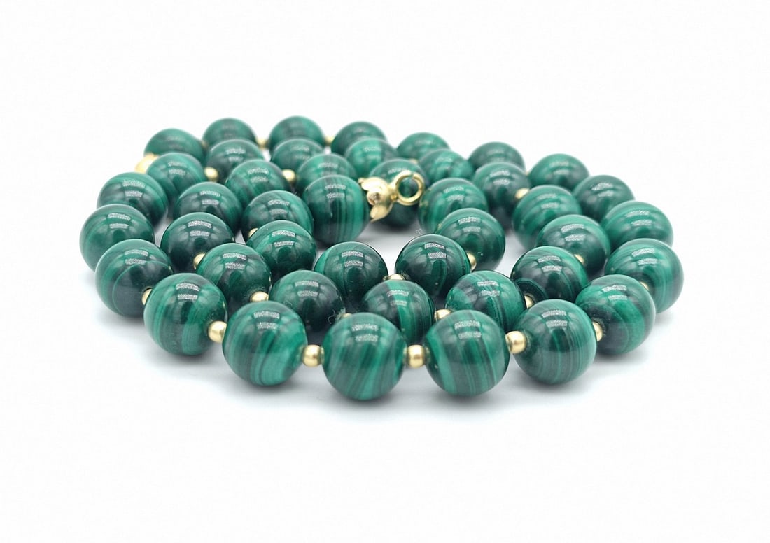 malachite necklace with 2 mm 18 kt gold spheres: Title:malachite necklace with 2 mm 18 kt gold spheres Description:8 mm malachite necklace with 2 mm 18 kt gold spheres 18 kt gold clasp length 43 cm weight 37 gr Date/Period:2022 Materials:Yellow Gold