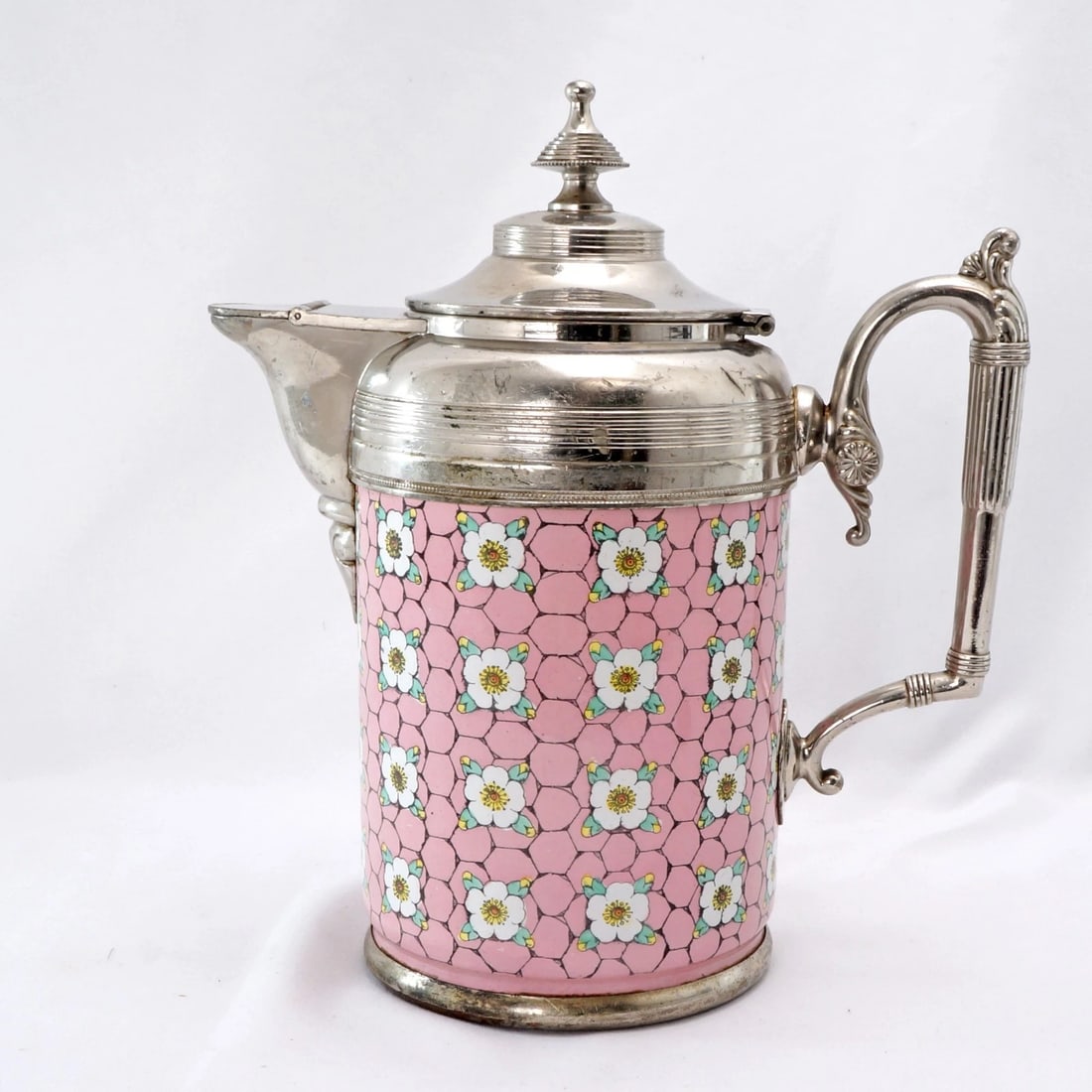 Victorian Graniteware Coffee Pot: Title:Victorian Graniteware Coffee Pot Size:8 ¾ in (22.2 cm) long x 4 ¾ in (12.1 cm) diameter x 10 in (25.4 cm) tall. Description:A striking Victorian-era coffee pot that features a vibr