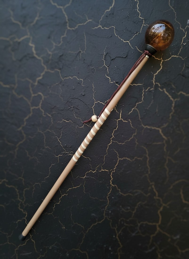 Vintage Spiral Wood Walking Stick with Antique Amber Art Glass Globe Top: Title:Vintage Spiral Wood Walking Stick with Antique Amber Art Glass Globe Top Description:This handmade walking stick features an antique amber art glass globe handle paired with a distinct spiral wo