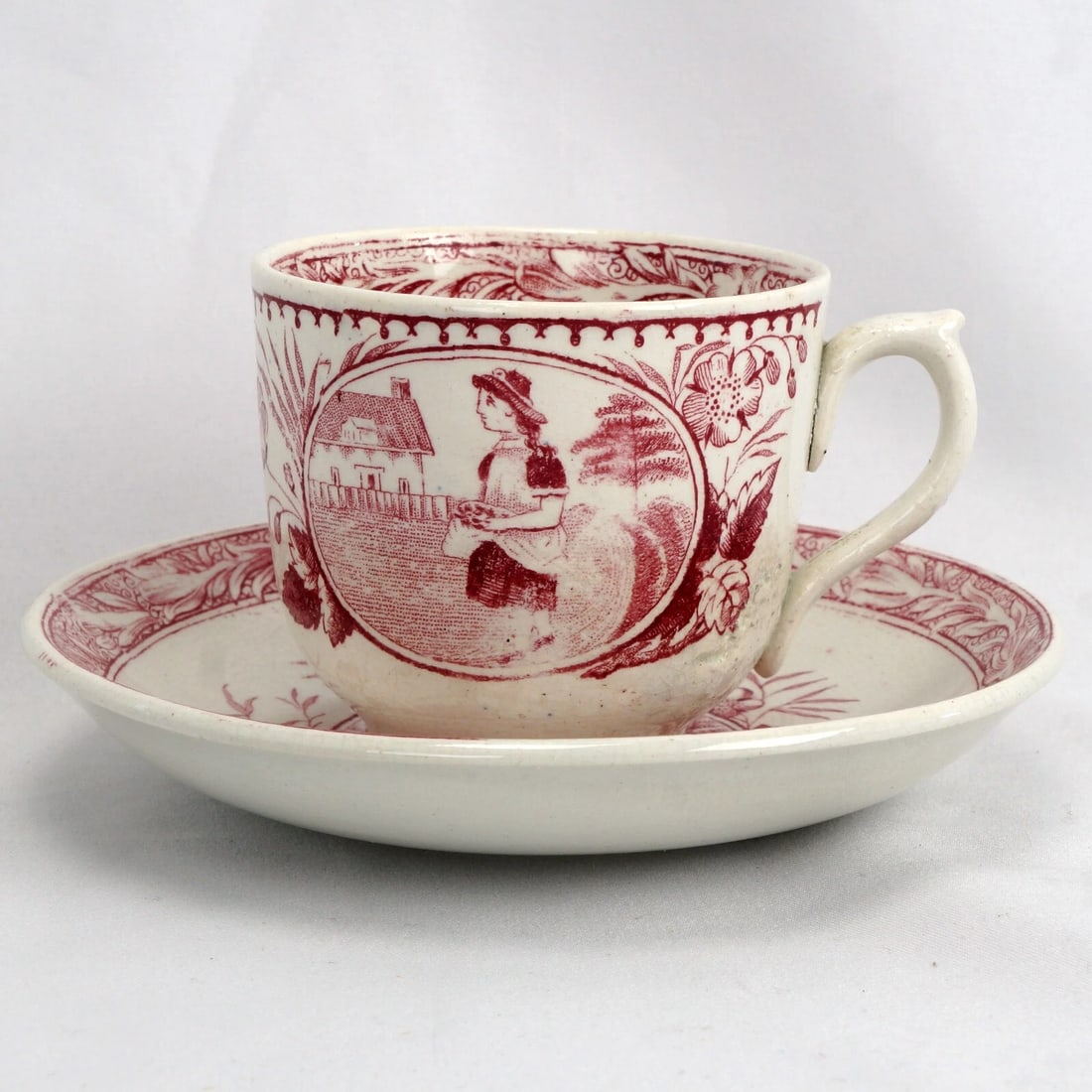 19th C Little Mae Child's Teacup and Saucer: Title:19th C Little Mae Child's Teacup and Saucer Size:Cup – 2 7/8 in (7.3 cm) diameter x 2 1/2 in (6.4 cm) tall. Saucer – 5 1/4 in (13.3 cm) diameter x 15/16 in (2.4 cm) deep. Description:An