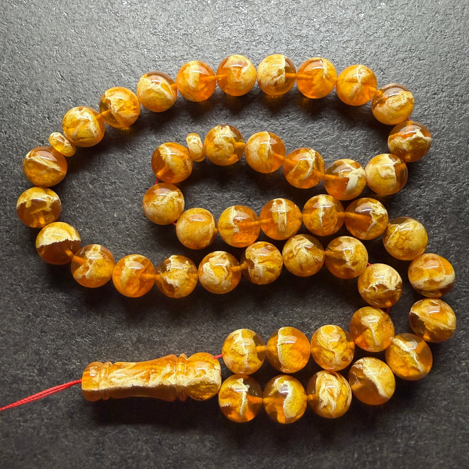 Staggering Amber Tesbih made from Round Amber beads: Title:Staggering Amber Tesbih made from Round Amber beads Metal:None Gemstone:Reconstituted Amber Weight:76.63 g Size:14mm Made of:(Reconstituted Amber or Whole Stone):Reconstituted Amber Additional
