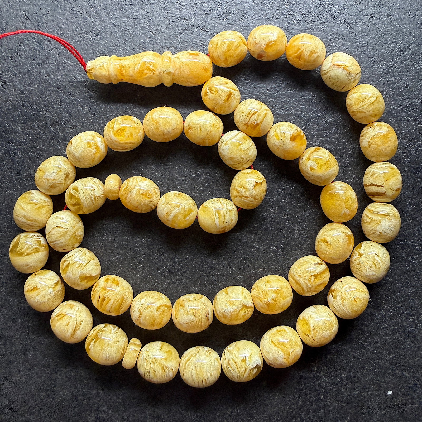 Exquisite Amber Tesbih made from Round Amber beads: Title:Exquisite Amber Tesbih made from Round Amber beads Metal:None Gemstone:Reconstituted Amber Weight:56.4 g Size:13x12 mm Made of:(Reconstituted Amber or Whole Stone):Reconstituted Amber
