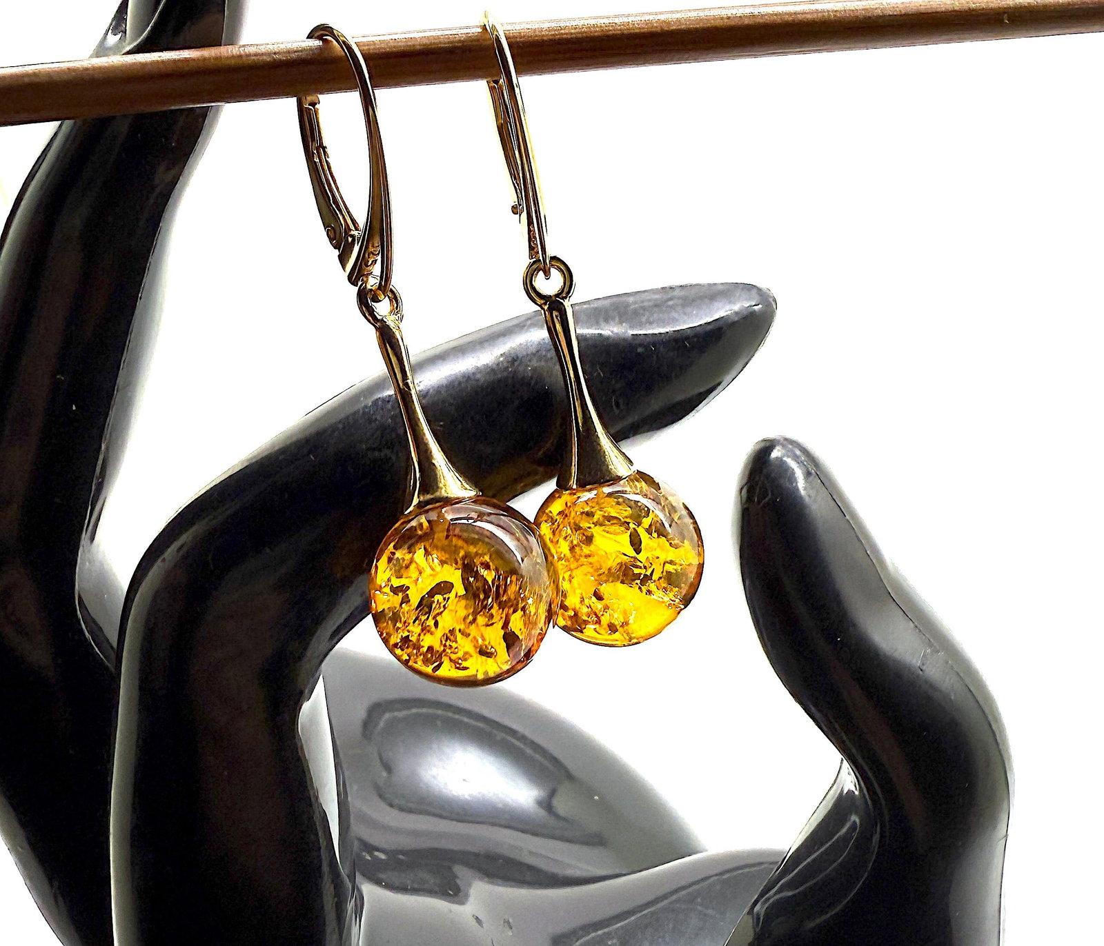 Astonishing Amber Earrings: Title:Astonishing Amber Earrings Metal:925 Silver-Gold Plated Gemstone:Amber Weight:4.4 g Size:Size: 12.0 x 12.0 x 40.0 mm Size: 0.472 x 0.472 x 1.575 inches Made of:(Reconstituted Amber or Whole