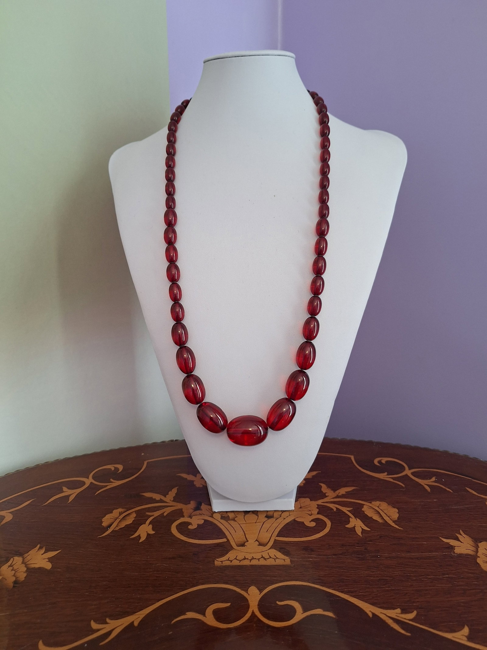 Antique Cherry Amber Bakelite Necklace: Title:Antique Cherry Amber Bakelite Necklace Description:Antique Cherry Amber Bakelite Necklace Gemstone:Bakelite Weight:65 gr Size/Dimensions:L72 cm Reserve: $650.00 Shipping: Domestic: Flat-rate of