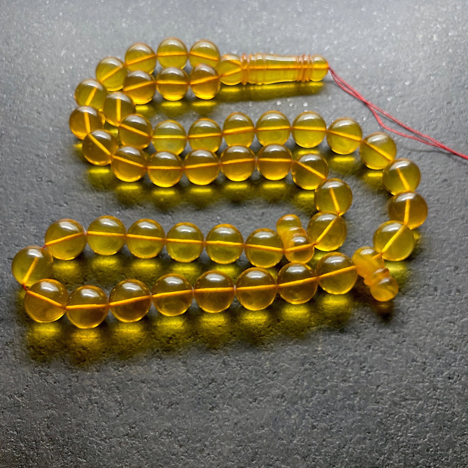 Alluring Amber Tesbih made from Round Amber beads: Title:Alluring Amber Tesbih made from Round Amber beads Metal:None Gemstone:Amber Weight:75.0 g Size:Bead size: 14.0 mm Bead size: 0.551 inches Made of:(Reconstituted Amber or Whole
