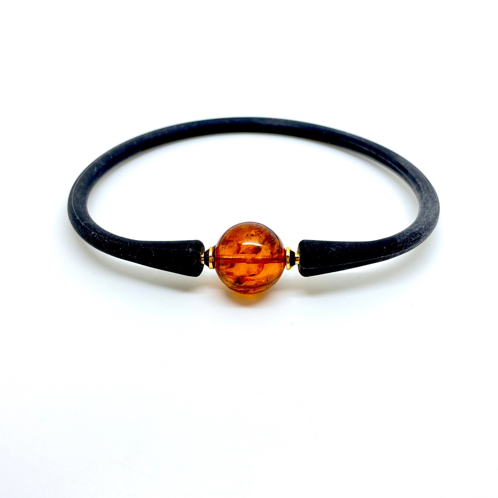Remarkable Amber Bracelet made from Round Amber bead: Title:Remarkable Amber Bracelet made from Round Amber bead Metal:None Gemstone:Amber Weight:4.7 g Size:Bead size: 13.0 mm Bead size: 0.512 inches Wrist length: 190.0 mm Made of:(Reconstituted Amber