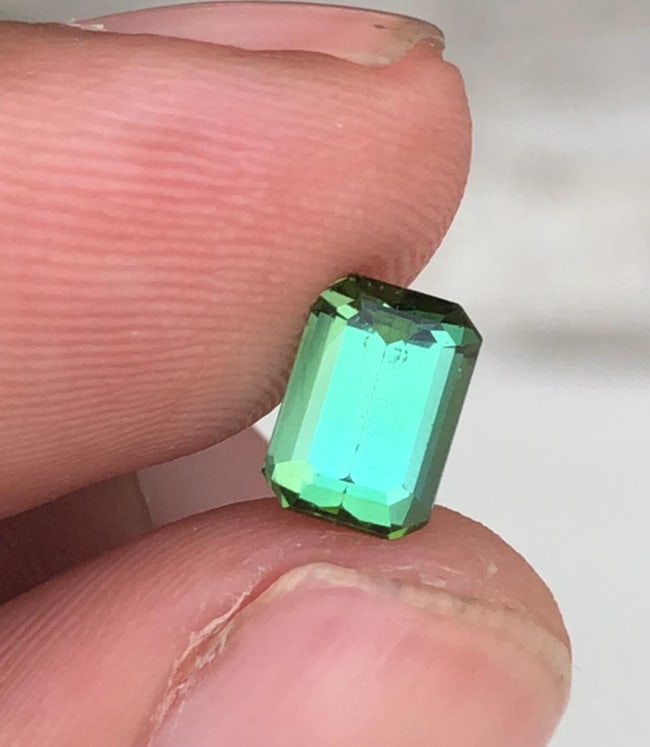 Natural Blue Green Tourmaline Emerald Cut Gemstone For Jewelry - 1.250 Carat: Tourmalinee Details: * Weight : 1.250 carat * Dimension : 7.4*5.2*3.9 mm * Shape : Emerald * Colour : Green * Origin : Afghanistan * Lustre: Vitreous * Certificate : On Customer Demand * SKU : V Reser