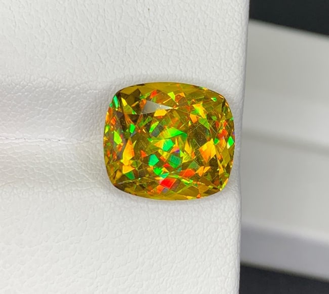 Lustrous Sphene Titanite Fancy Cushion Gemstone: 8.48 Carat Multi Color Titanite, June Birthstone: Highlights Supplies for making crafts Materials: Gemstone: Sphene Weight : 8.48 cts Dimensions : 12 * 10.8 * 7.9 MM Color : Multi Color Shape : Cushion Clarity : Clean Treatment : Natural Origin : Afr