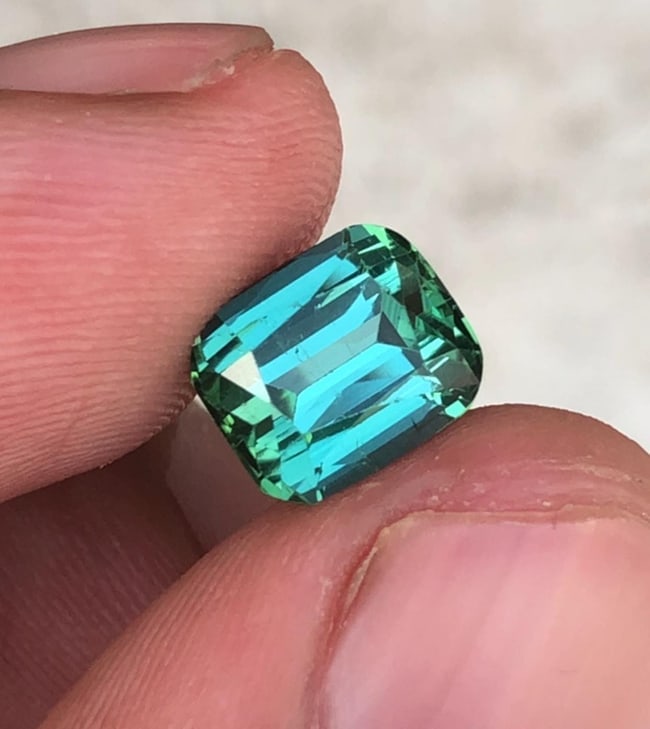 Natural Green Tourmaline Cushion Cut Gemstone For Wedding Ring - 2.670 Carat: Tourmalinee Details: * Weight : 2.670 carat * Dimension : 8.2*6.9*5.6 mm * Shape : Cushion Cut * Colour : Green * Clarity : Eye Clean * Origin : Afghanistan * Lustre: Vitreous * Certificate : On Custo