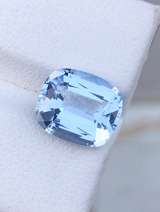 Natural Blue Aquamarine Cushion Shape Gemstone From Minas Gerais Mine Brazil - 4.535 Carat: Aquamarine Details: * Weight : 4.535 carat * Dimension : 11.1*9.5*6.4 mm * Shape : Cushion * Color : Blue * Origin : Brazil * Luster: Vitreous * Mineral Class : Beryl * Certificate : On Customer