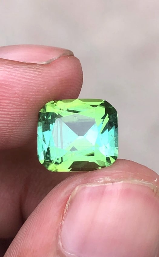 Natural Mint Green Tourmaline Cushion Cut Gemstone For Ring - 4.60 Carat: Weight : 4.60 Carat Dimensions : 10.3*9.3*6.5 MM Shape : Cushion Cut Clarity : VS Color : Mint Green ( Jaba Green ) Treatment : None Origin : Afghanistan Hardness : 7.5-8 Family : Elbaite SKU : E ( G 