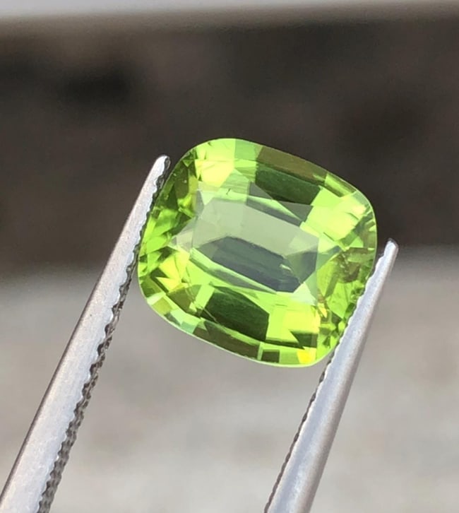 Natural Green Peridot Cushion Cut Gemstone For Engagement Ring - 3.195 Carat: Peridot Details * Weight : 3.195 carat * Dimension : 9.3*8.5*5.1 MM * Color : Green * Shape : Cushion * Hardness : 6.5 - 7 * Mineral Class : Olivine * Mine: Sapat * Origin : Pakistan * Associated mont