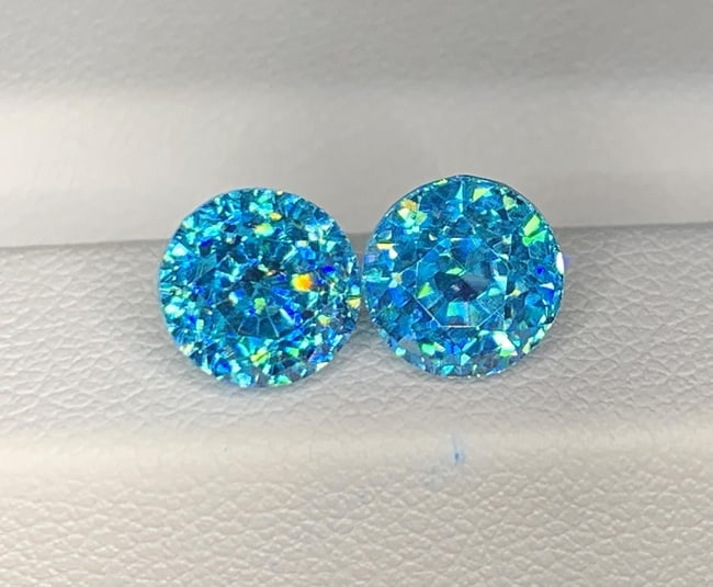 Cambodian Blue Zircon Pair Gemstone : Round Cut: Highlights Supplies for making crafts Materials: Gemstone: Zircon Cambodian Blue Zircon Pair Gemstone Elevate your jewelry collection with the exquisite beauty of this Natural Full Fire & Sparkly Camb