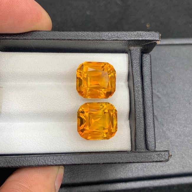 Madeira Citrine Gem Pair: 17.18 ct Orange Cushion Cut Stones: Sunset in Your Hands! "A rare find, perfect for a statement piece of jewelry!" This pair of cushion cut citrines is a rare find, boasting a uniform bright orange color that's sure to captivate. The