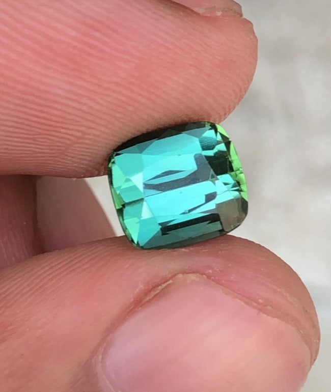 Natural Green Tourmaline Cushion Cut Gemstone For Anniversary Ring - 2.475 Carat: Tourmalinee Details: * Weight : 2.475 carat * Dimension : 7.9*7.1*5.5 mm * Shape : Cushion Cut * Colour : Green * Clarity : Eye Clean * Origin : Afghanistan * Lustre: Vitreous * Certificate : On Custo